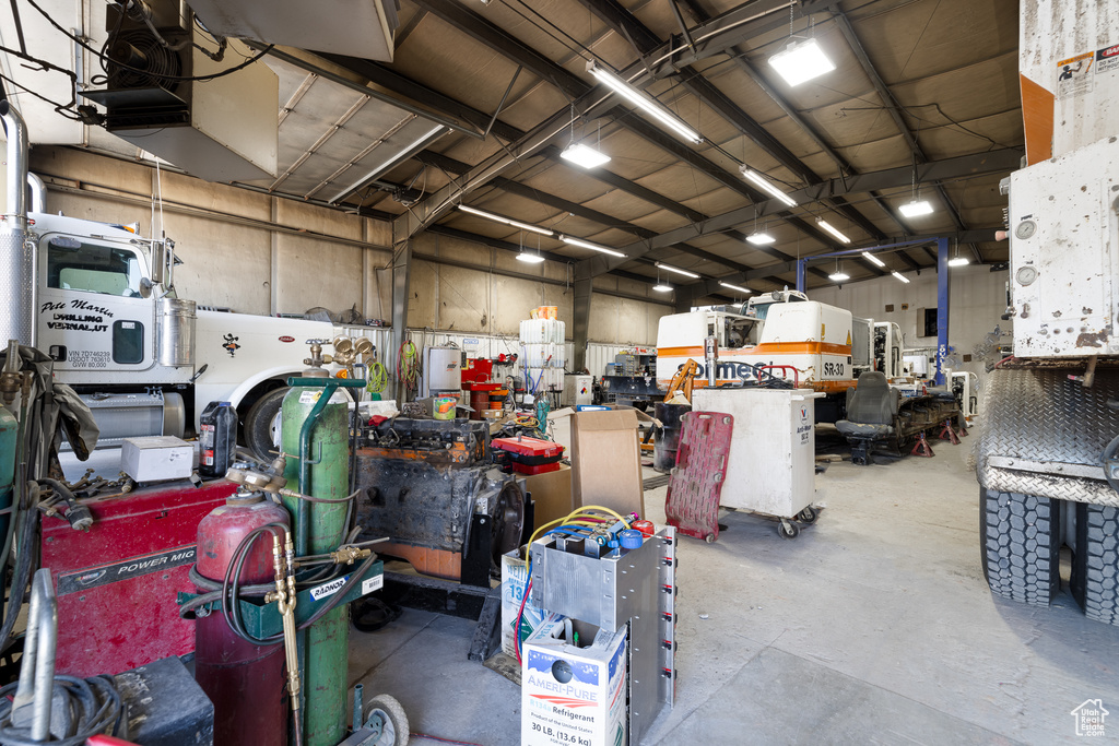 Garage with a garage door opener and a workshop area