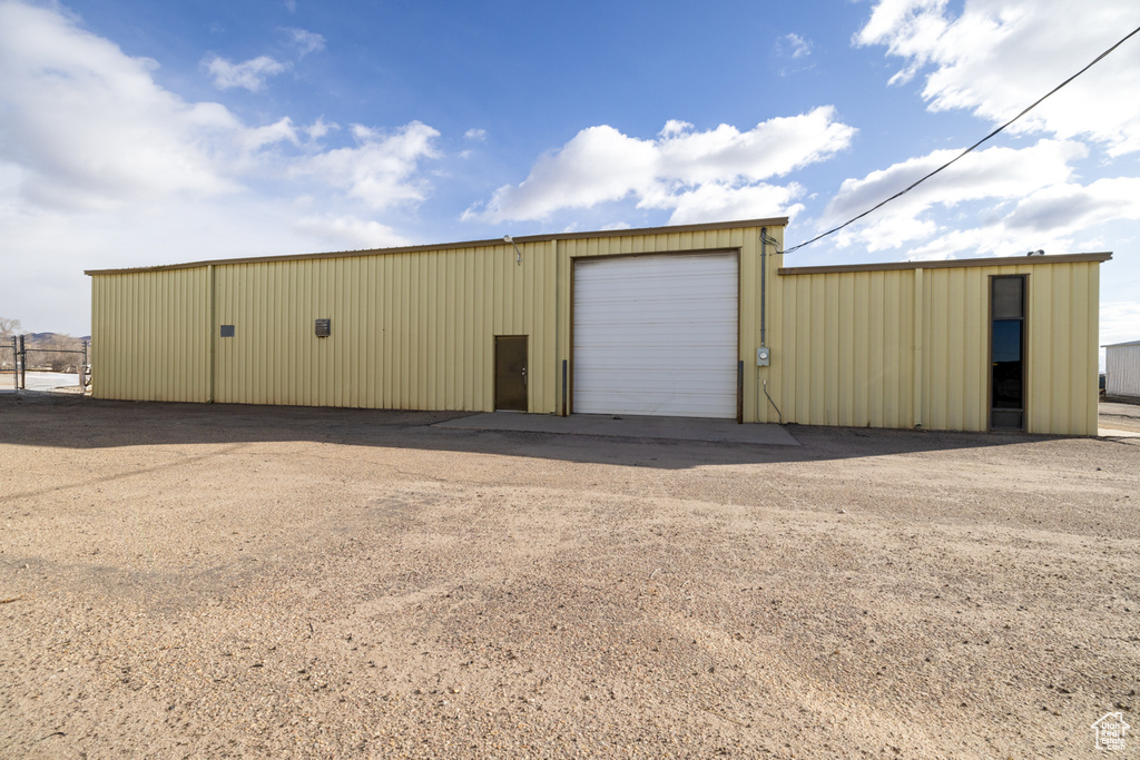 View of outdoor structure featuring a garage