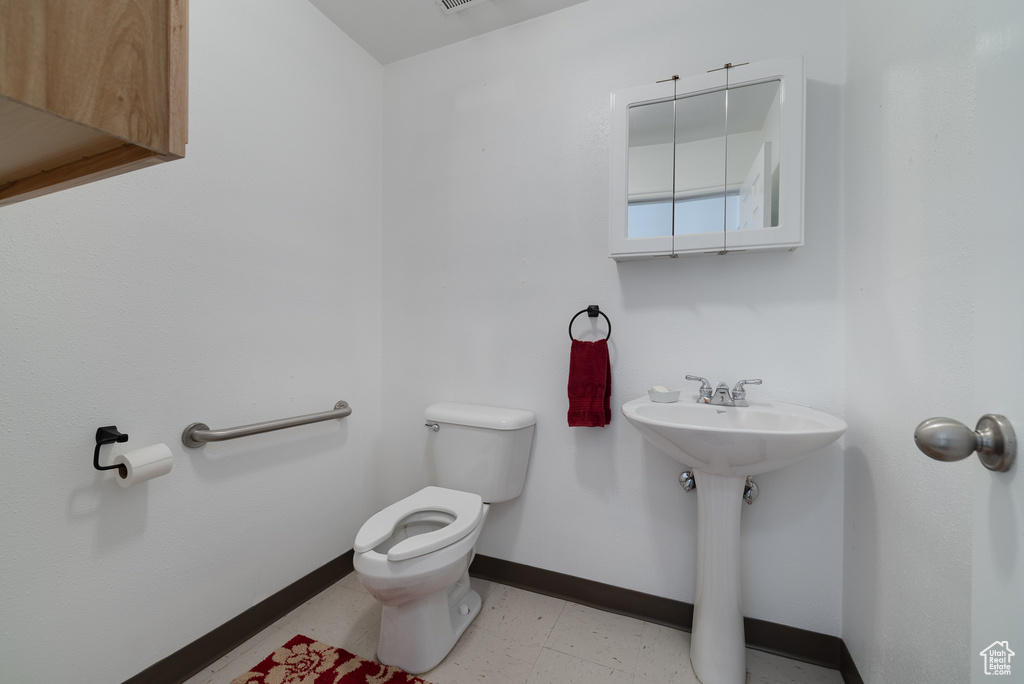 Bathroom with toilet and sink