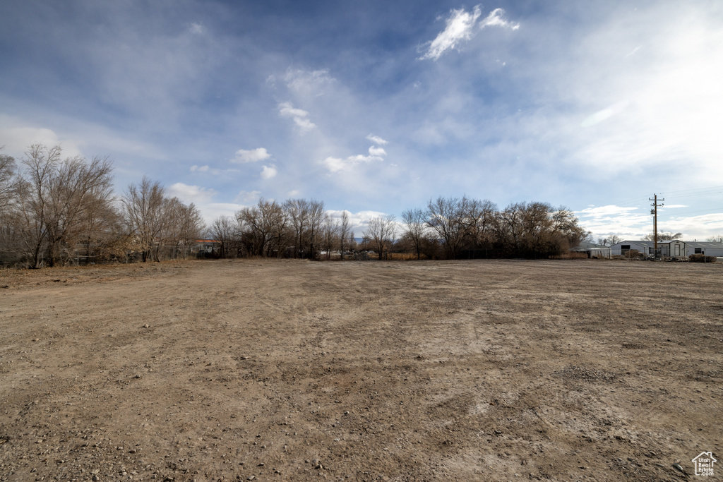 View of yard with a rural view
