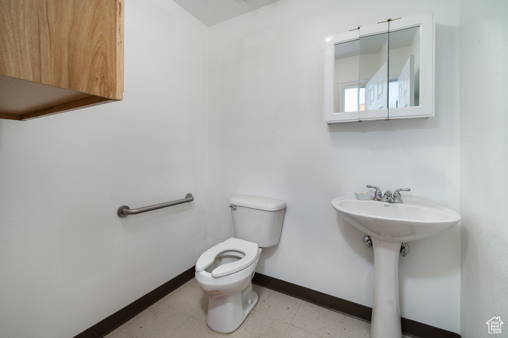 Bathroom with sink and toilet
