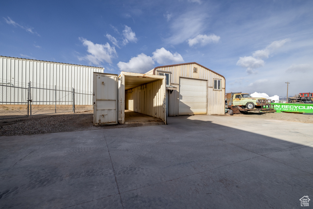 Exterior space featuring an outbuilding and a garage