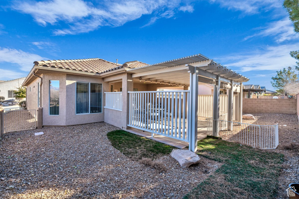View of side of home featuring a pergola