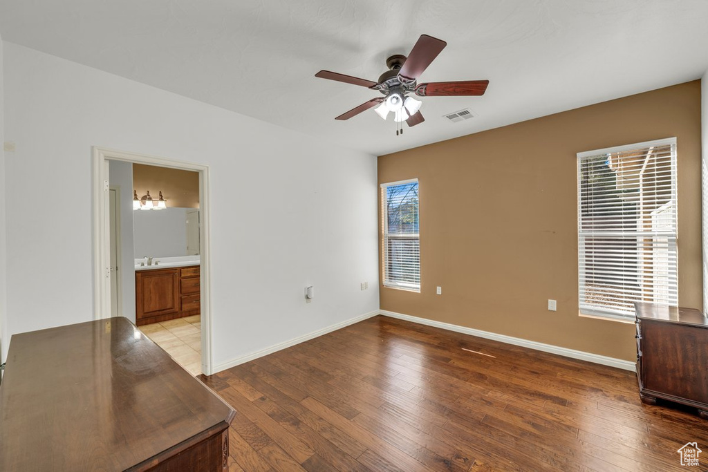 Spare room with ceiling fan and light wood-type flooring