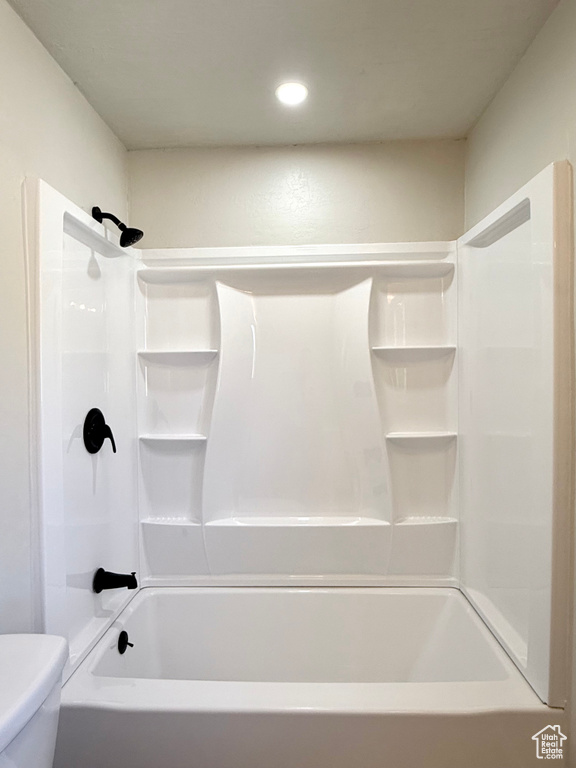 Bathroom with toilet and shower / bathtub combination