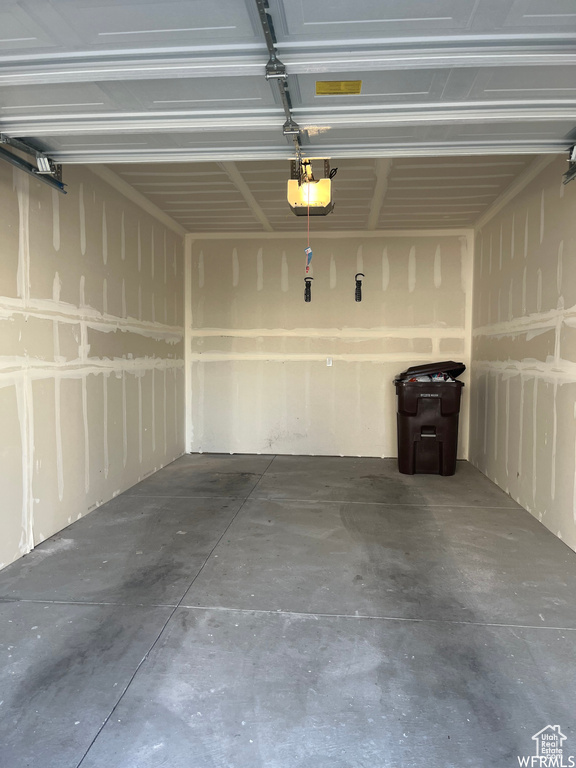 Garage featuring a garage door opener
