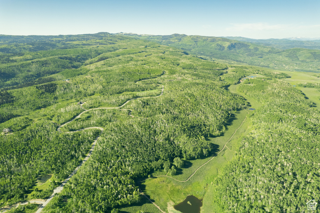Aerial view of property\'s location featuring mountains