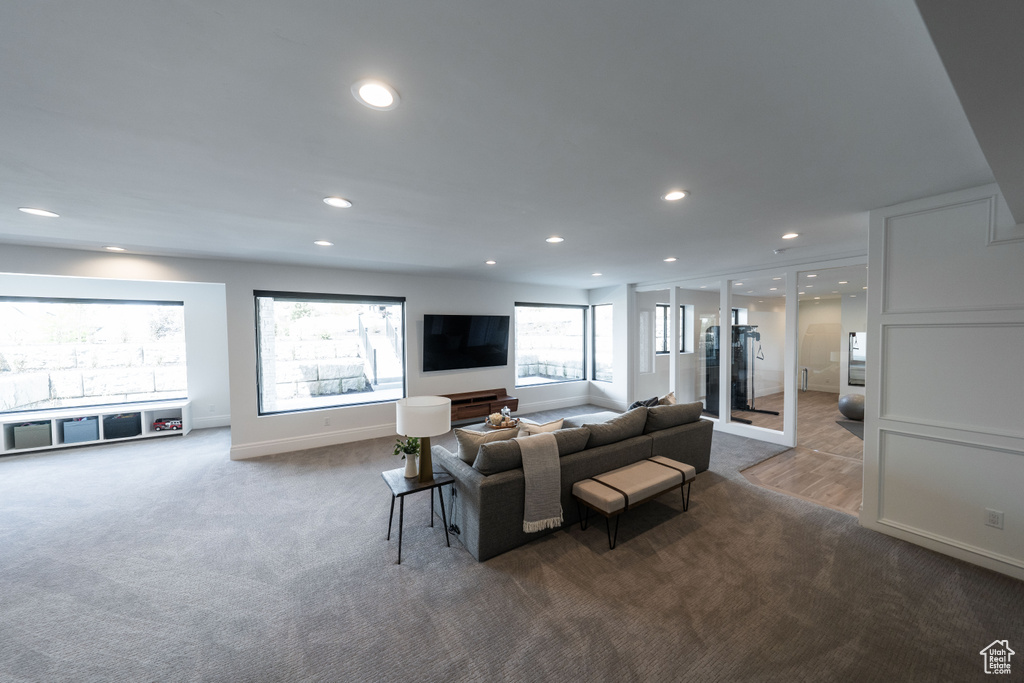Living room with recessed lighting and carpet floors
