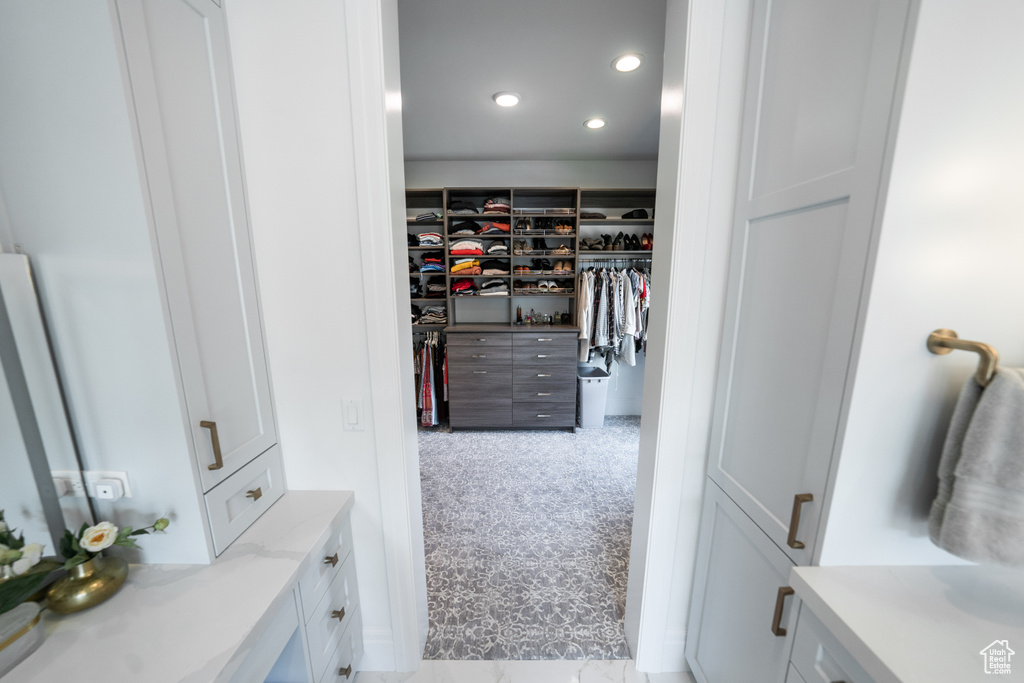 Spacious closet with carpet floors