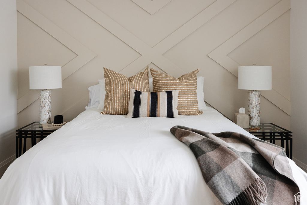 Bedroom featuring vaulted ceiling