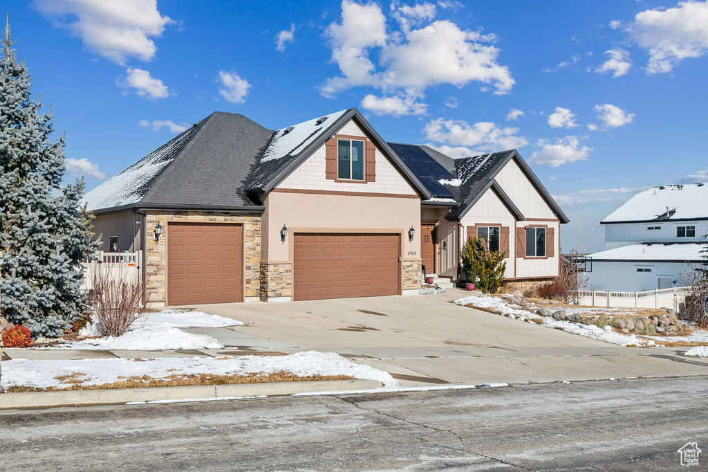 Craftsman-style home featuring a garage