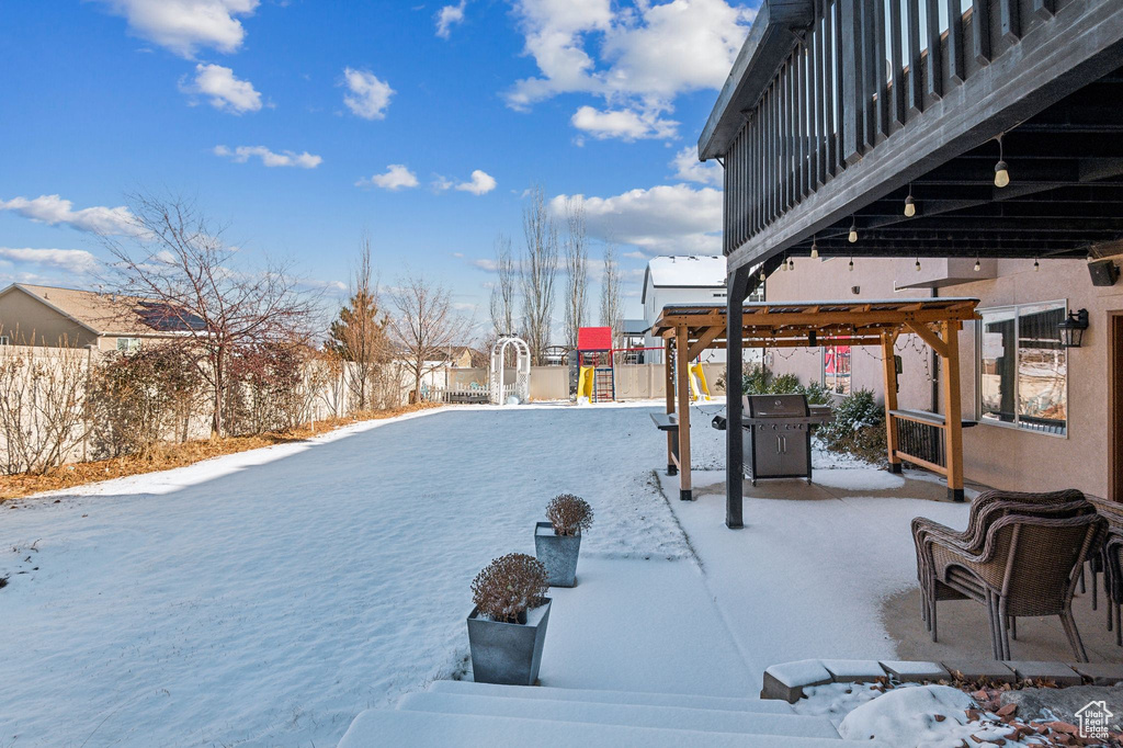 Snowy yard with a playground