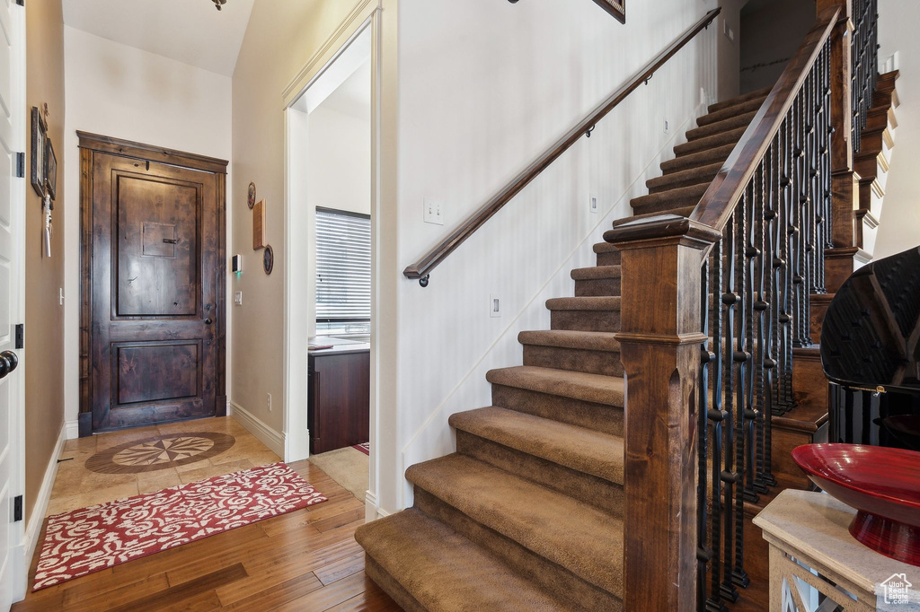 Foyer entrance with light hardwood / wood-style floors