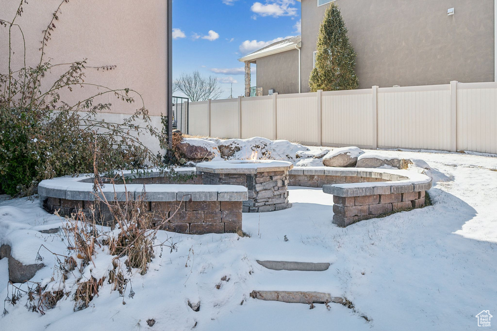 View of yard layered in snow