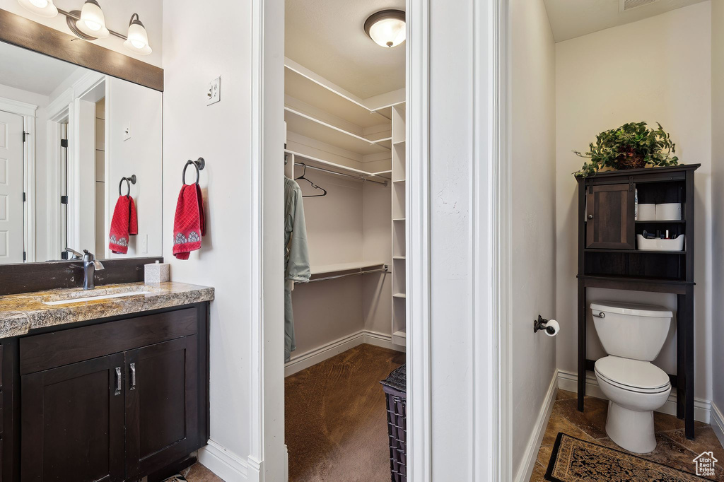 Bathroom with vanity and toilet