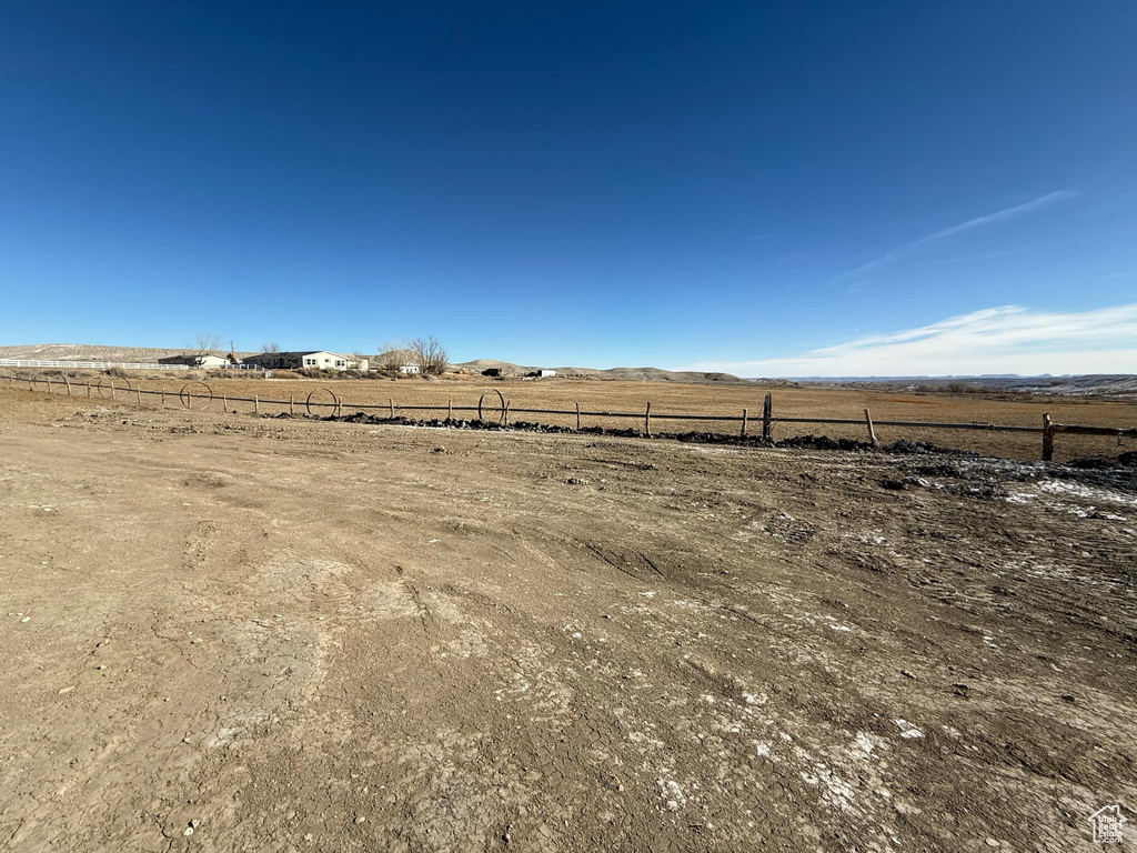 View of yard with a rural view