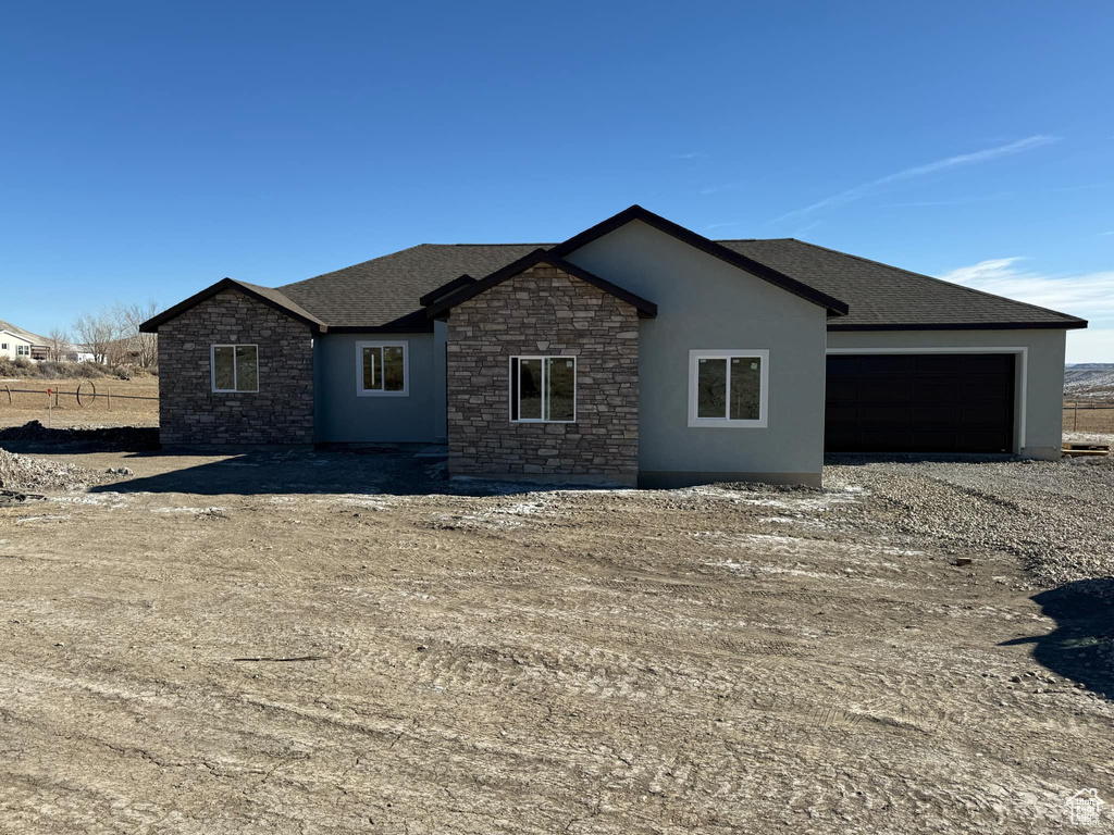 Rear view of house with a garage