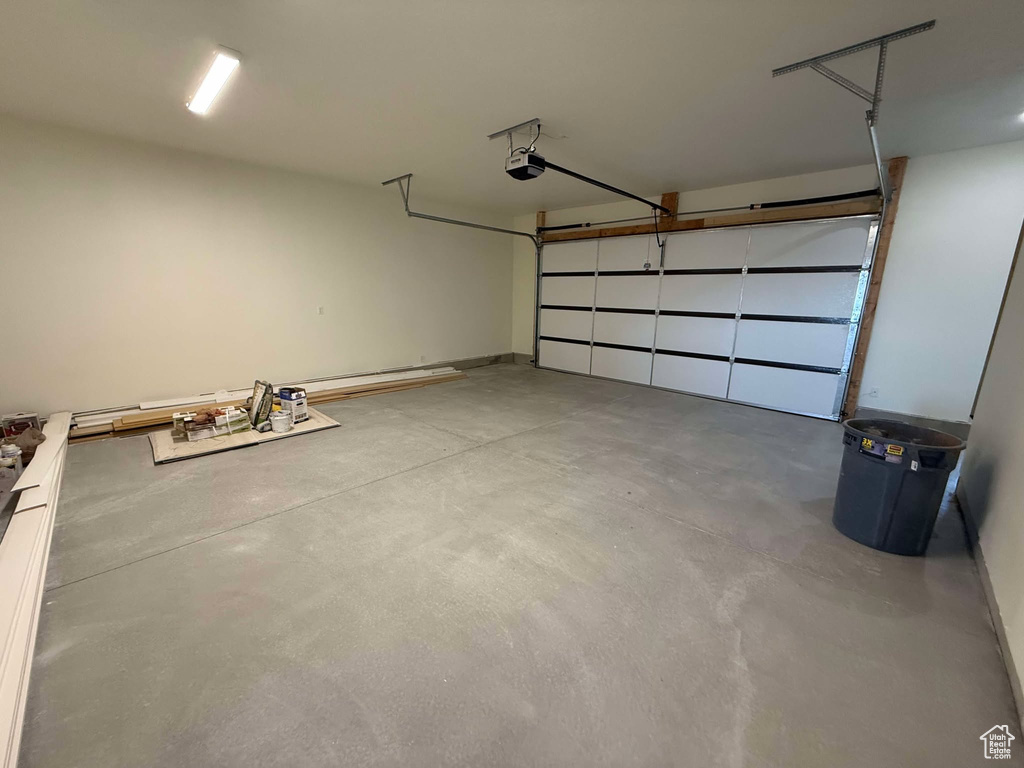 Garage featuring a garage door opener