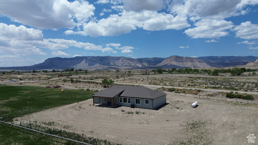 View of mountain background featuring rural landscape
