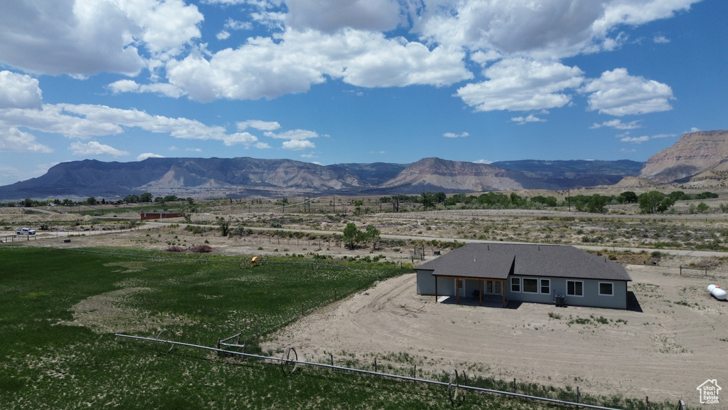 View of mountain backdrop with rural landscape