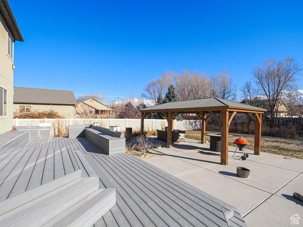 Wooden terrace with a gazebo and outdoor lounge area