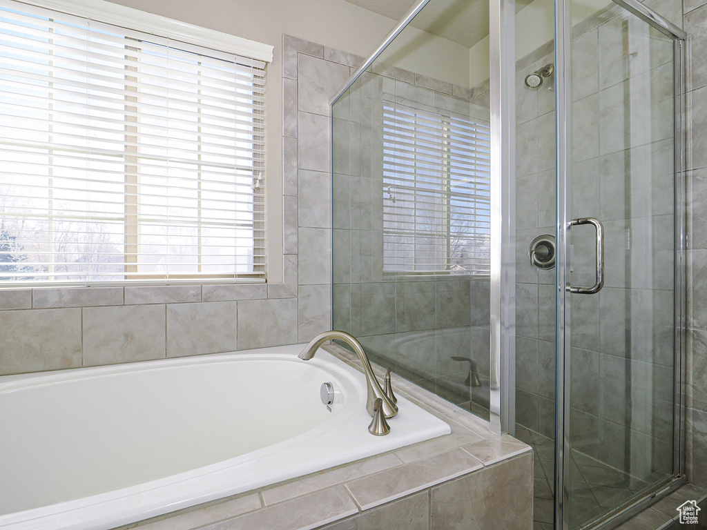 Bathroom featuring independent shower and bath