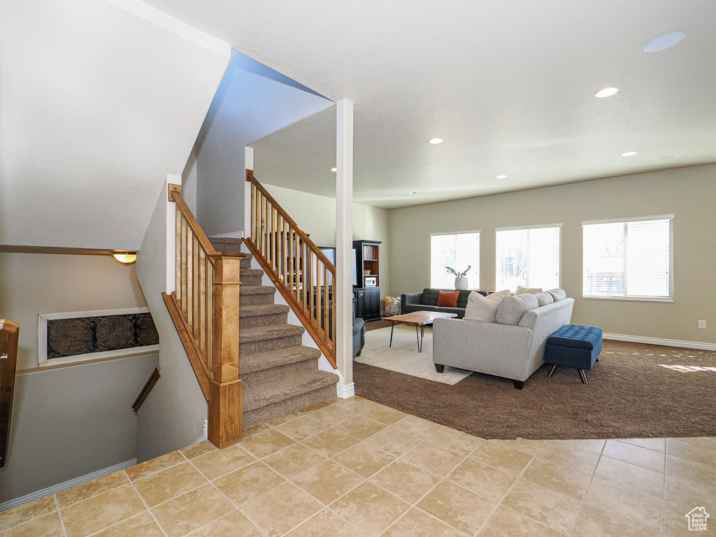 Living room with light tile patterned floors