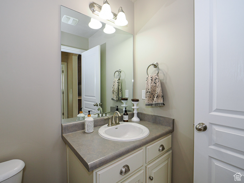 Bathroom featuring toilet and vanity