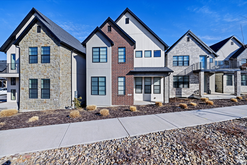 View of front of home featuring brick siding