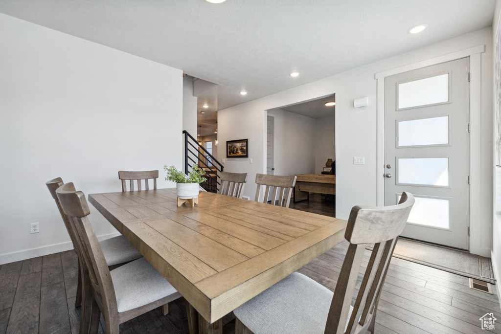 Dining area with recessed lighting, visible vents, stairway, hardwood / wood-style floors, and baseboards
