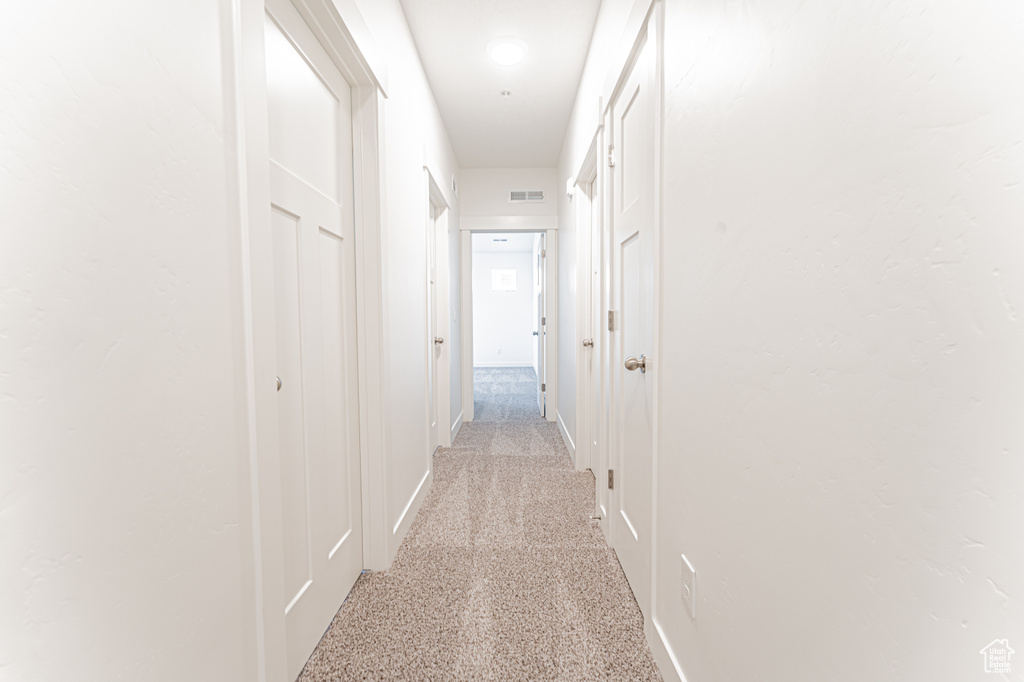 Hall featuring baseboards