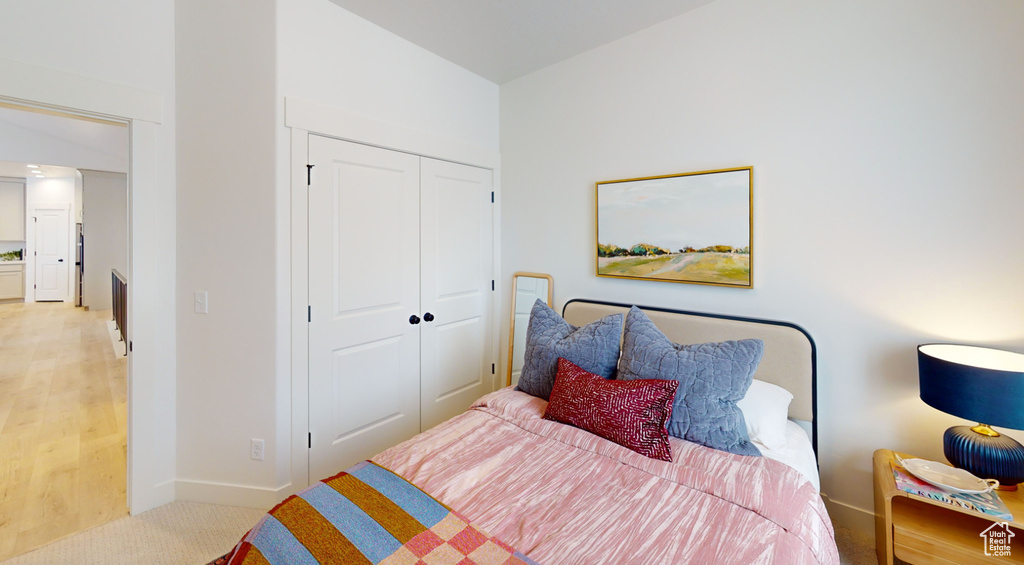 Bedroom with a closet and baseboards
