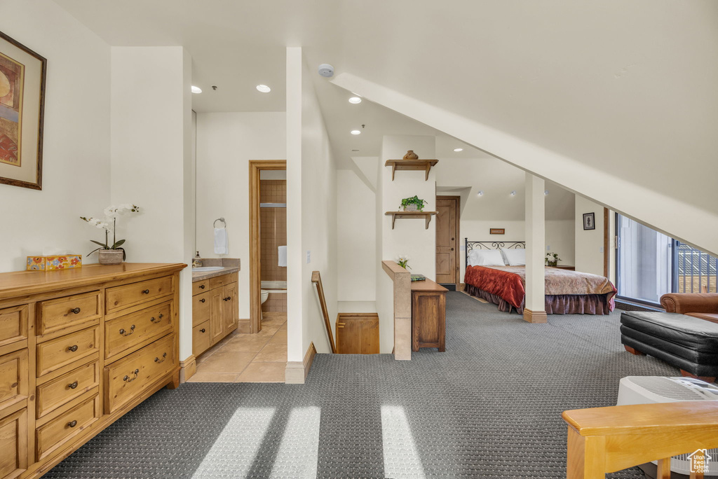 Carpeted bedroom with ensuite bathroom