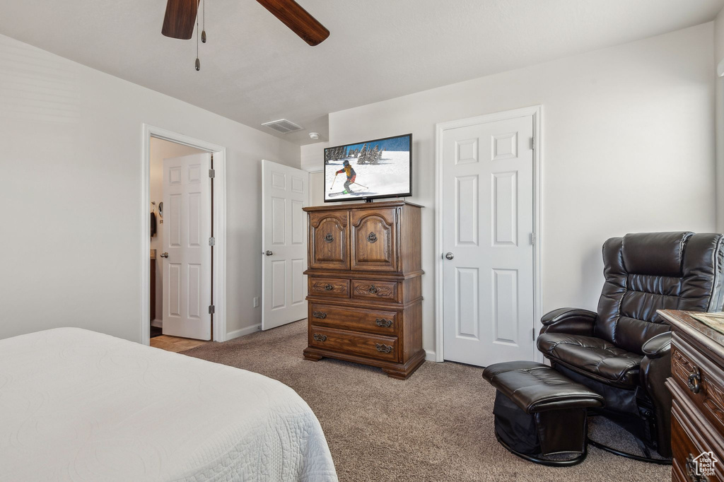 Bedroom featuring ceiling fan and light colored carpet