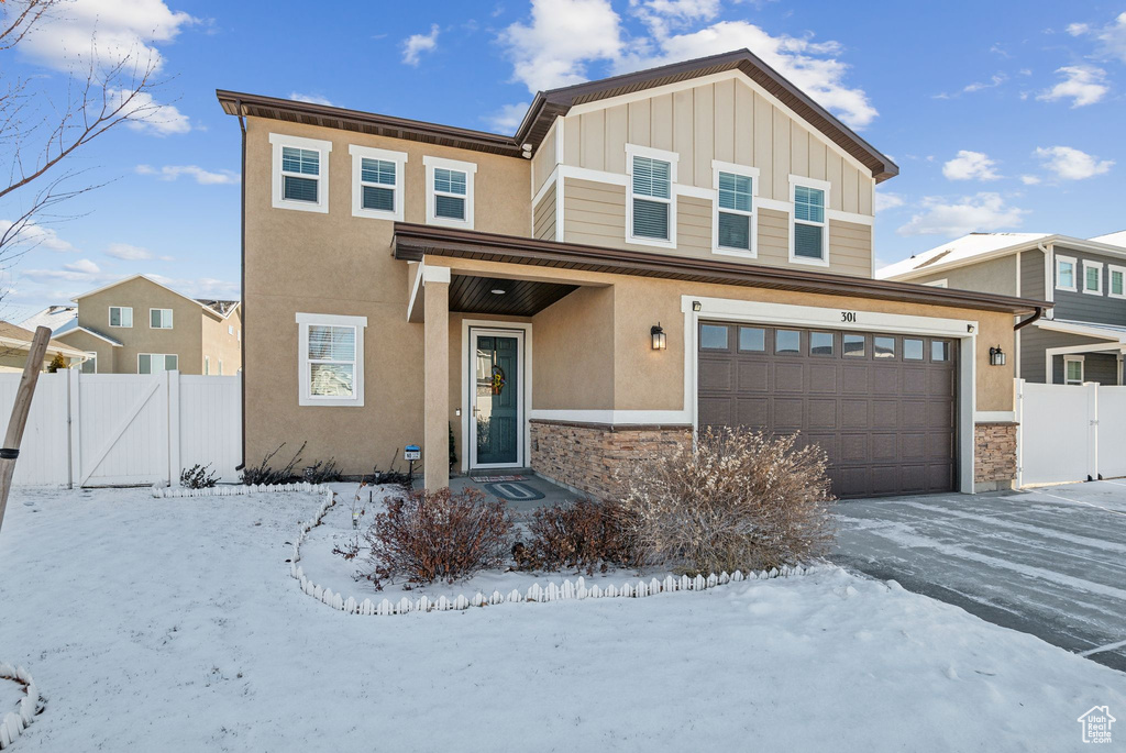 View of front of property with a garage