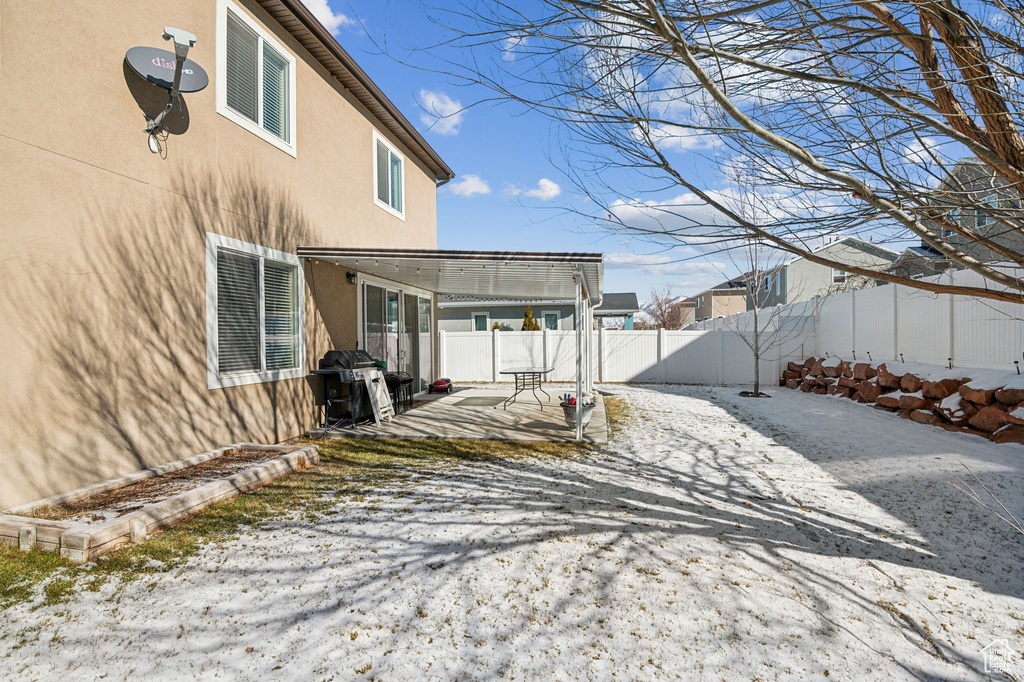 View of yard covered in snow