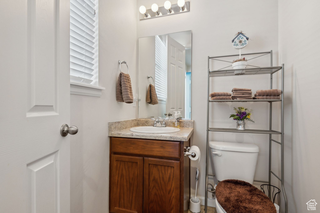 Bathroom with toilet and vanity