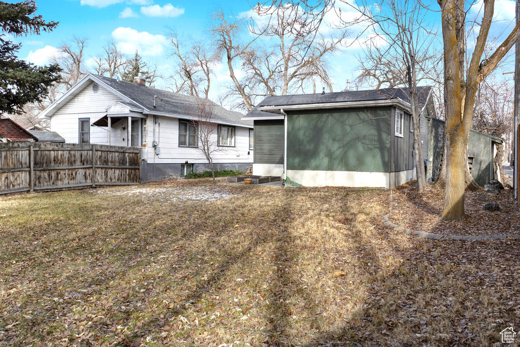 Exterior space featuring a yard