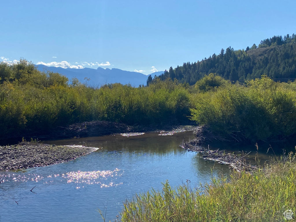 Property view of water with a mountain view