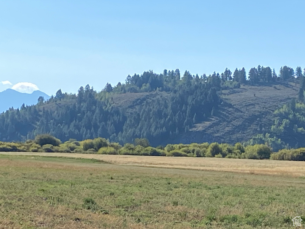 Property view of mountains with a rural view