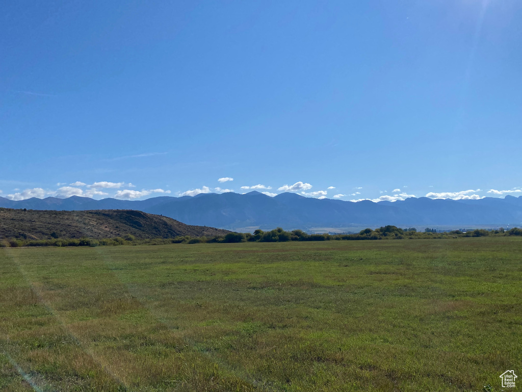 Property view of mountains with a rural view