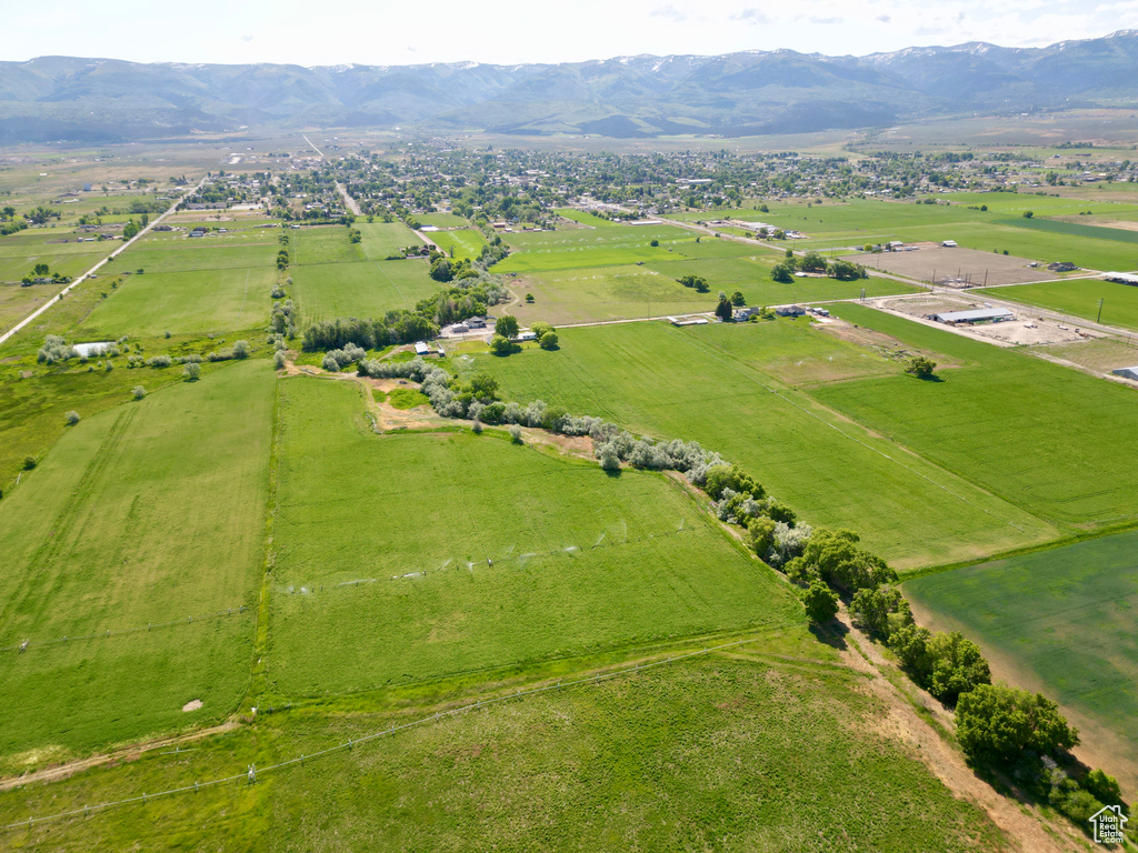 Aerial view of sparsely populated area featuring mountains and agricultural land