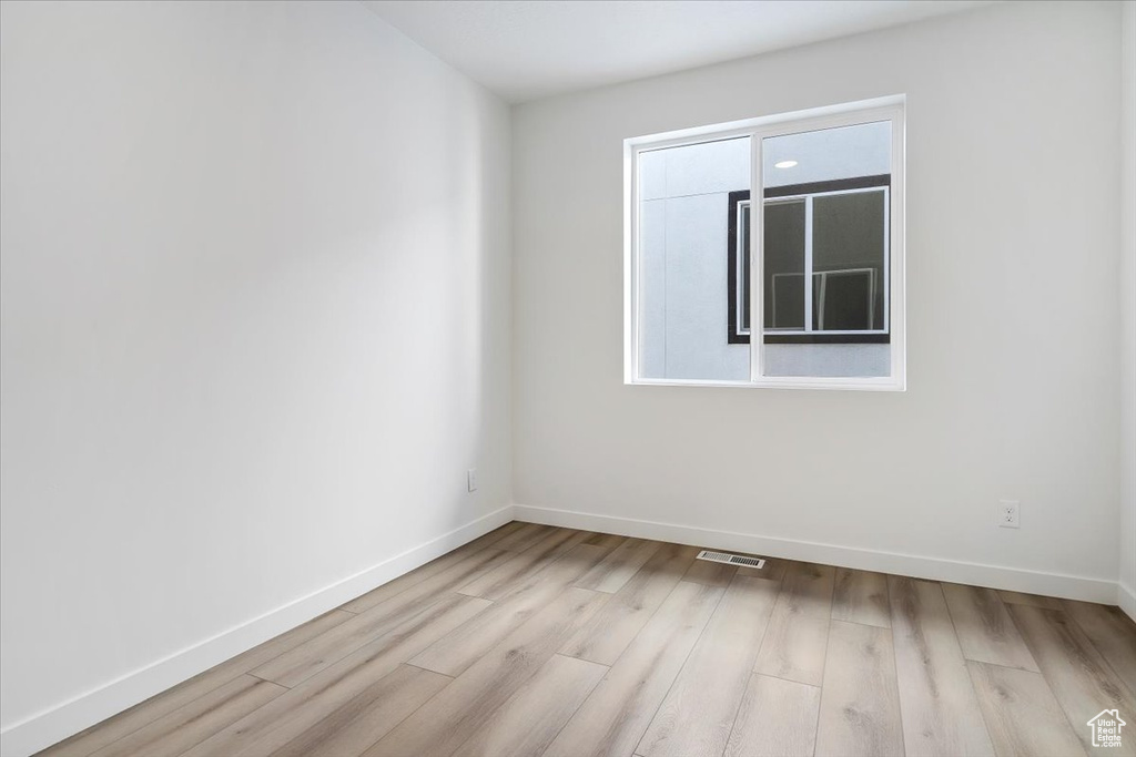 Spare room featuring light hardwood / wood-style floors