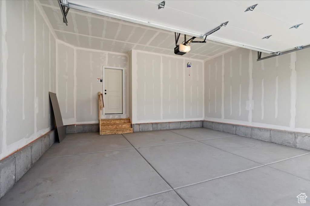 Garage featuring a garage door opener