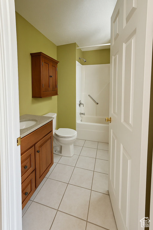 Full bathroom featuring toilet, tile patterned flooring, vanity, and shower / bathing tub combination