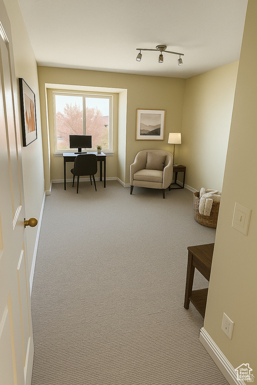 Carpeted home office with baseboards