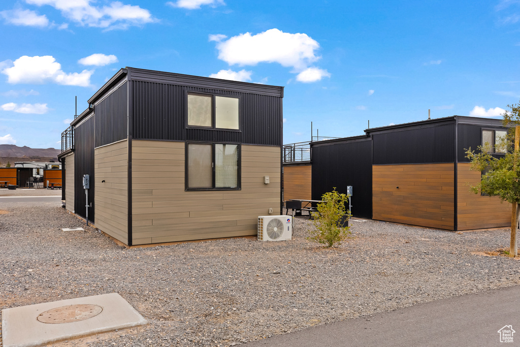 View of property exterior featuring ac unit