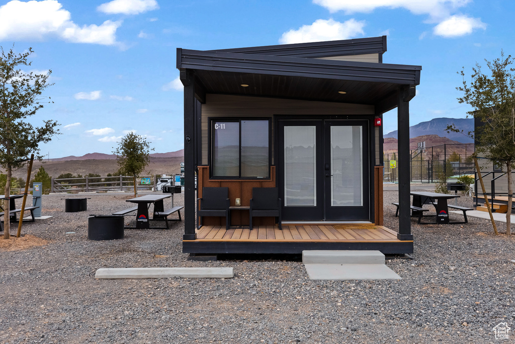 Exterior space with a mountain view and french doors