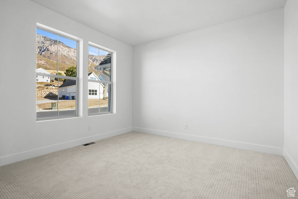 Empty room with carpet floors