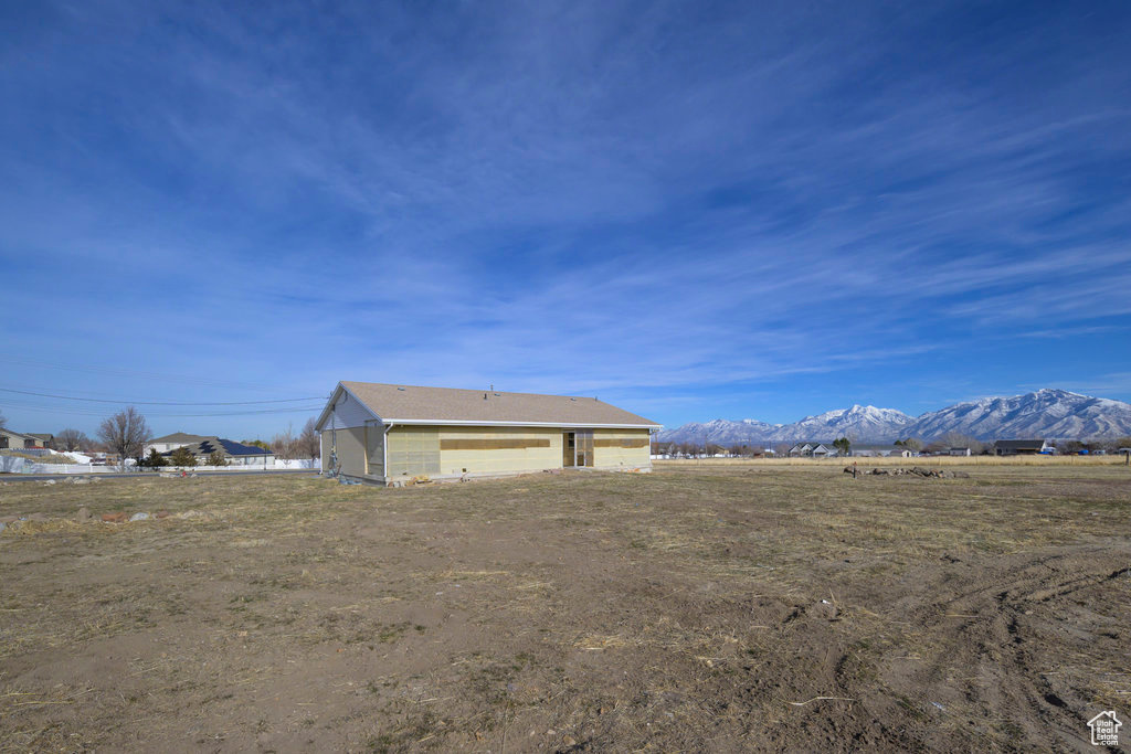Exterior space with a garage and a mountain view